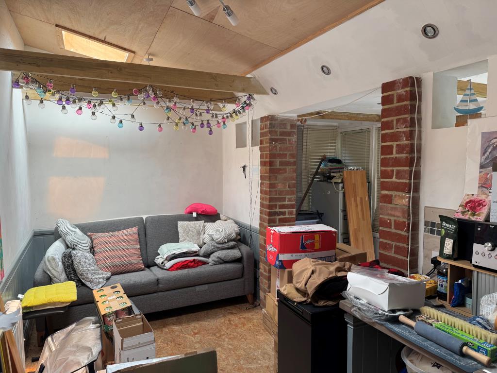 Lot: 61 - TOWN CENTRE BUILDING COMPRISING TWO SHOPS, A FLAT AND WITH SCOPE FOR FURTHER SUB-DIVISION - The Staff Living Room at the Back of the Shop Number 21
